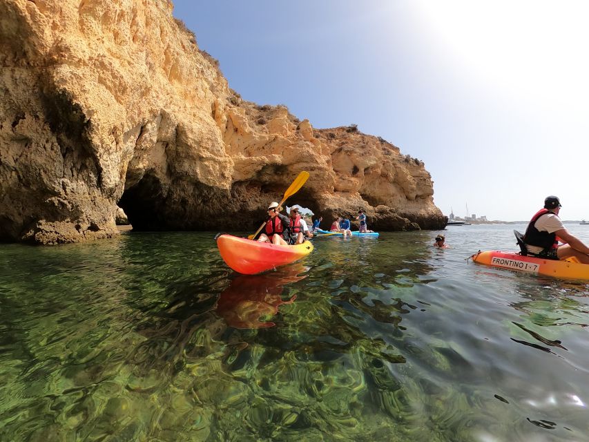 Alvor: Explore Caves Boat and Kayak Tour - Paddling through caves and coastal arches