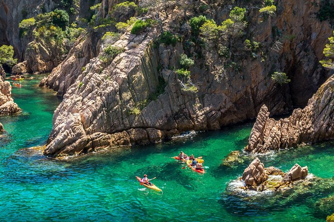 Barcelona Costa Brava Kayak, Snorkel & Cliff Jump Day Tour - Paddling below the Camino de Ronda