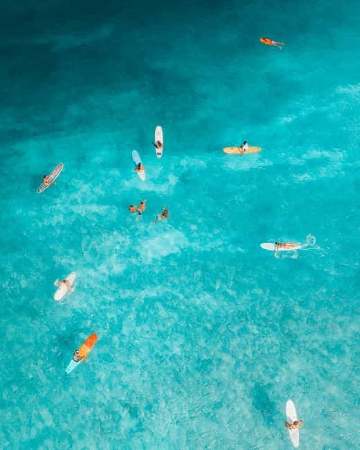 Barcelona: Sunrise or Sunset Paddle Surf with Photos - Learning to balance on the board