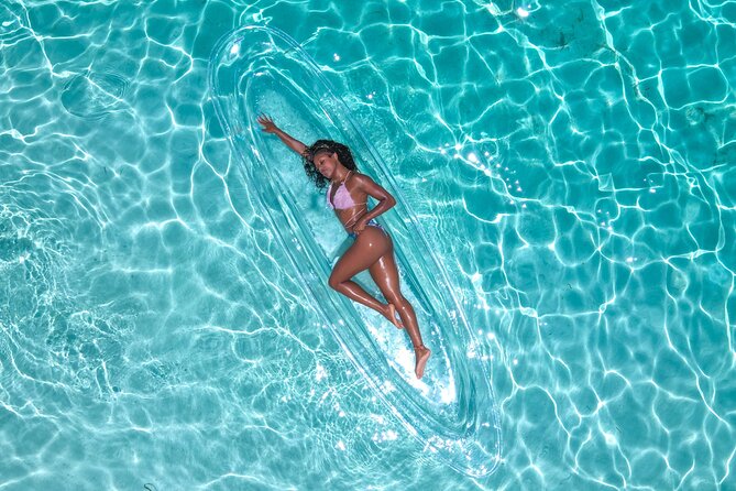 Clear Kayak Drone Photoshoot in Nassau Bahamas - Jasmine and the assistant make the posing easier