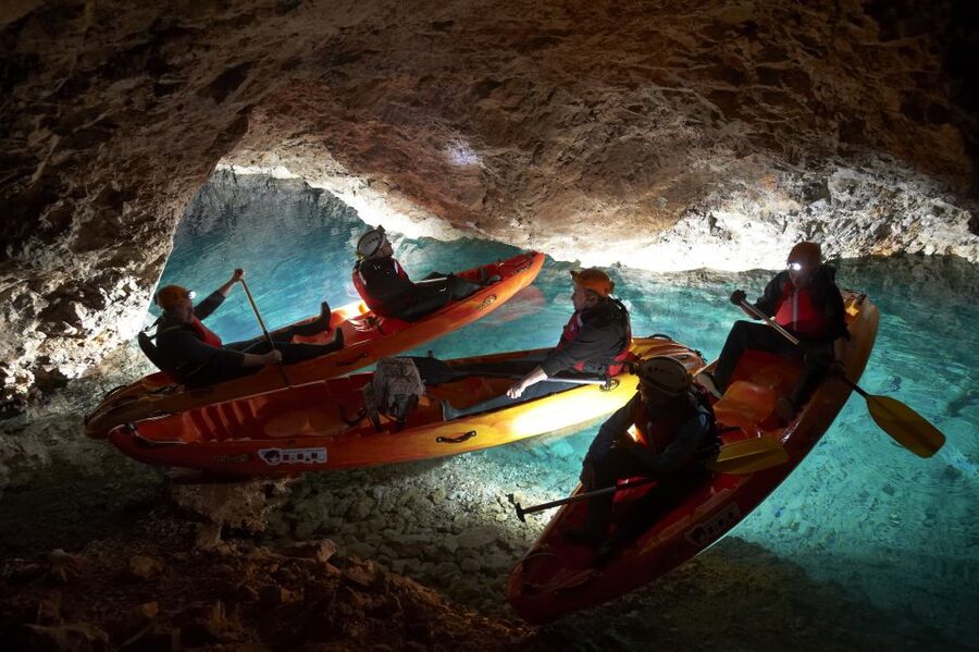From Bled: Full-Day Underground Kayaking - Riding an old train into the mine