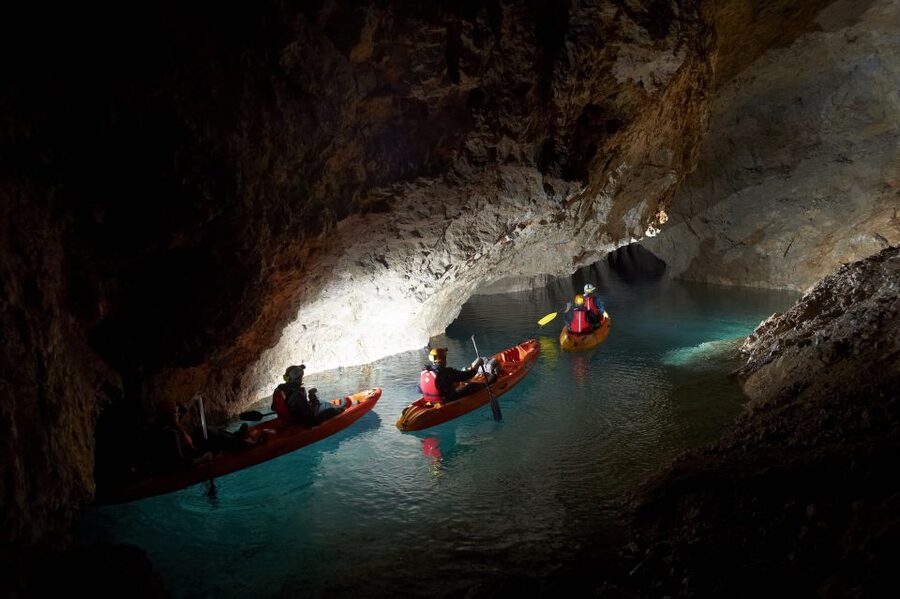 From Bled: Full-Day Underground Kayaking - Getting suited up beside the underground water