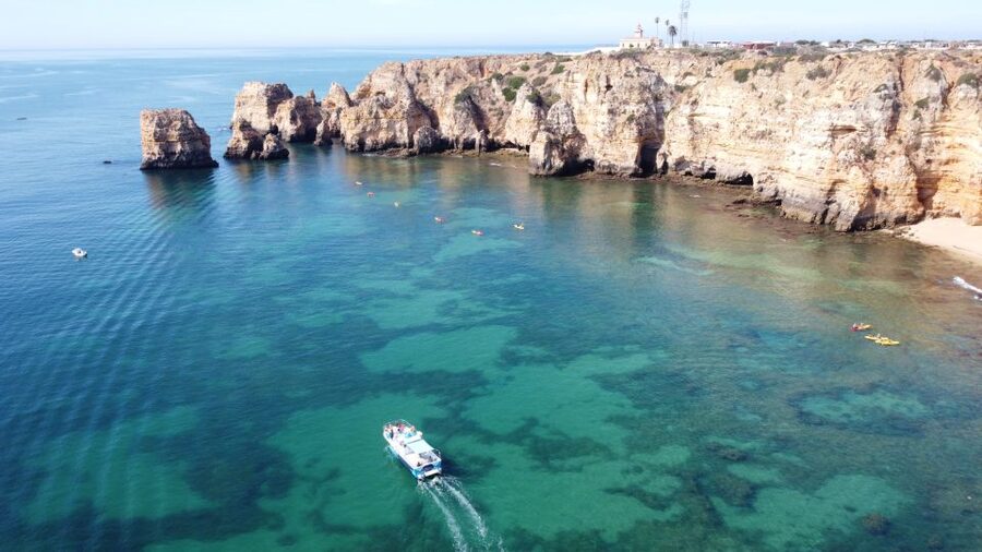 From Lagos: Kayak Experience in Ponta da Piedade - The boat ride out to the launch area