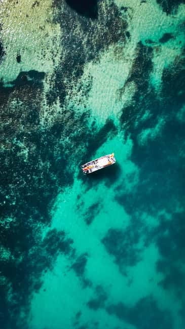 From Lagos: Ponta da Piedade Caves Kayak Tour from Catamaran - Sliding into a double kayak