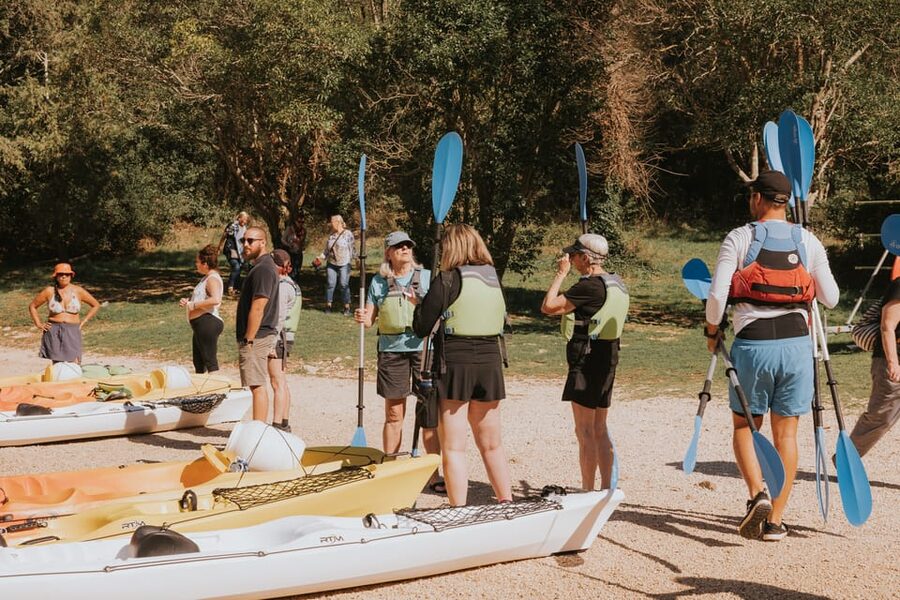 From Poreč: Lim Bay Sea Kayaking Day Trip - The rocky beach and swim stop