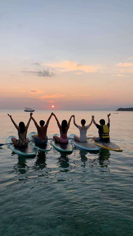 gili sunrise Stand-up paddle boarding or kayaking (droneshot - Crossing toward Gili Meno by board or kayak