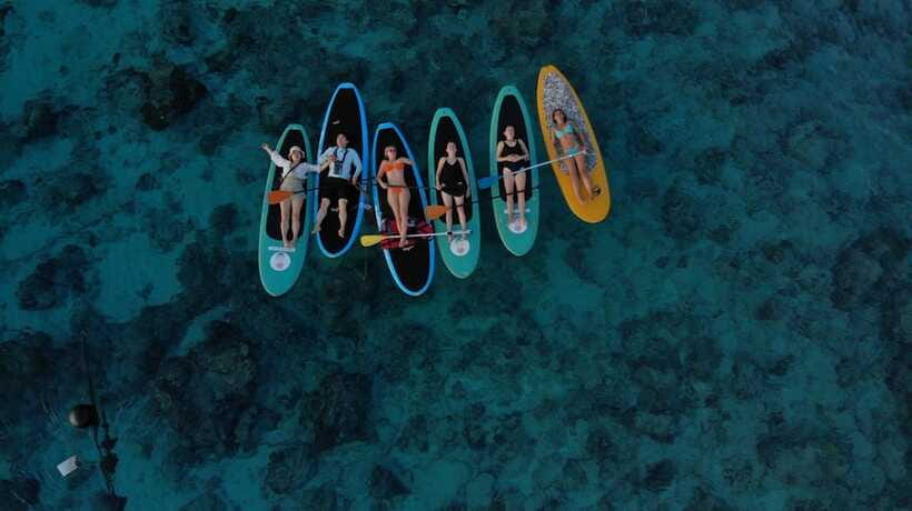 gili sunrise Stand-up paddle boarding or kayaking (droneshot - Snorkeling near Gili Meno’s underwater statues