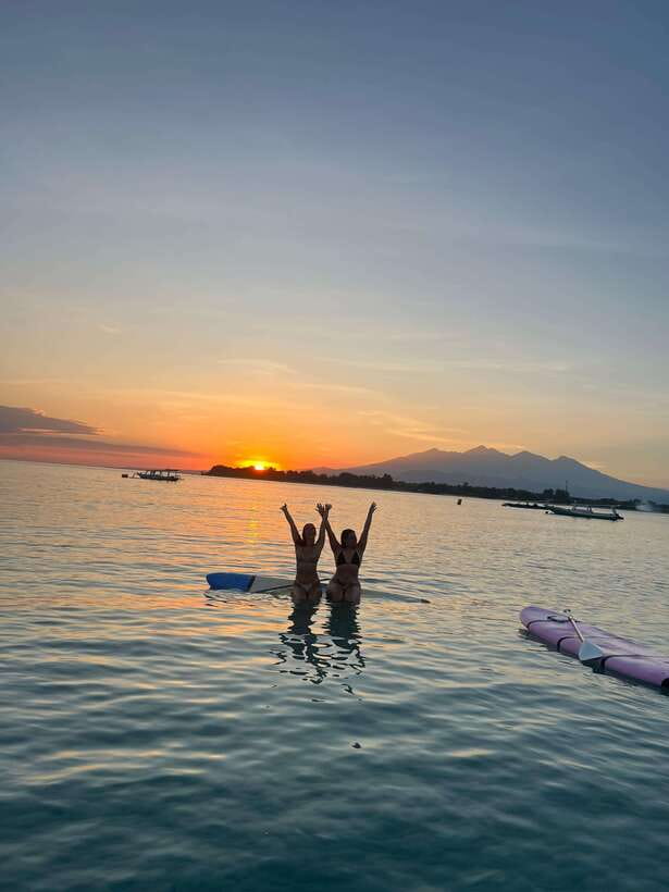 gili sunrise Stand-up paddle boarding or kayaking (droneshot - Starting with a short lesson