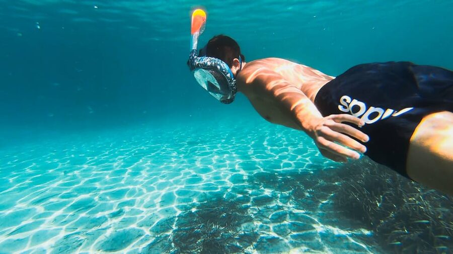 Golfo Aranci: Sunset Dolphin Kayak Tour with Aperitif - Finding Spiaggia dei Baracconi