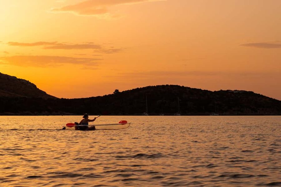 Golfo Aranci: traditional or transparent kayaks, dolphins, and aperitifs - Cala Moresca and Figarolo Island
