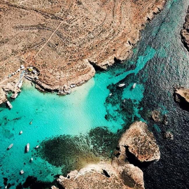 Gozo: 1 Hour Kayak plus +Cave Tour + Drop off Blue Lagoon - Entering Santa Maria Caves by boat
