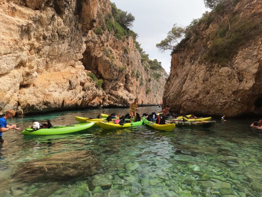 Granadella: Caló, Cova Llop Marí, and Ambolo Kayak Trip - Weather, sea conditions, and physical demands