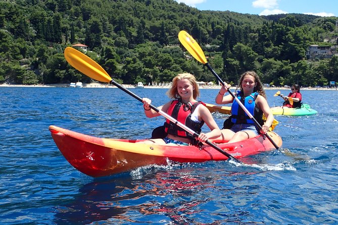 Half-Day Split Sea Kayak Adventure - The beach stop: swimming, snorkeling, and optional cliff jumping