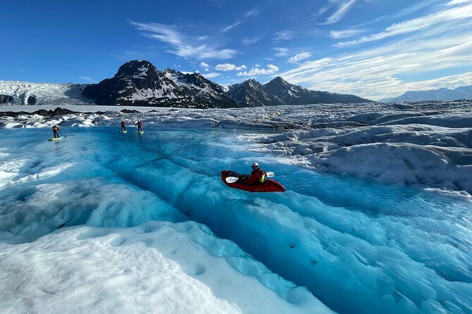 Helicopter and Glacier Paddle Boarding -PRIVATE - Paddle boarding across glacial meltwater