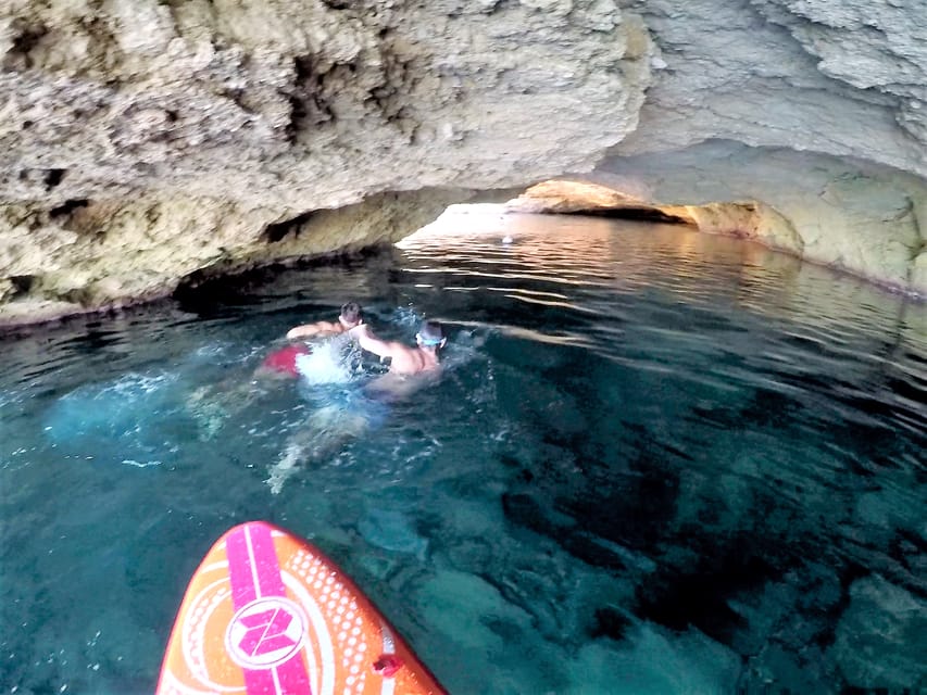 Ibiza: Sea Caves & Coves Snorkeling Paddle Boarding Tour - Drinks, fruit, music, and the boat’s social mood