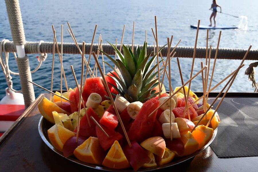 Ibiza: Sunset Boat Trip with Snorkeling, Kayaking, & Drinks - Music, refreshments, and the party-boat mood