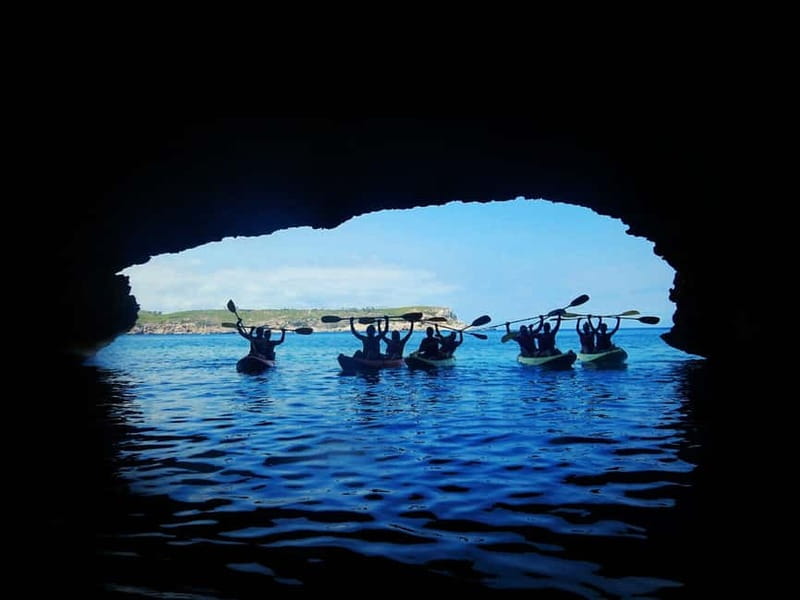 Ibiza: Xarraca Bay Guided Kayaking Tour - Paddling between islets toward the caves