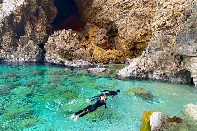Kayak Paradise: Cala Portixol Snorkel, Cave & Cliff Jumping Tour - Swimming in the blue lagoon