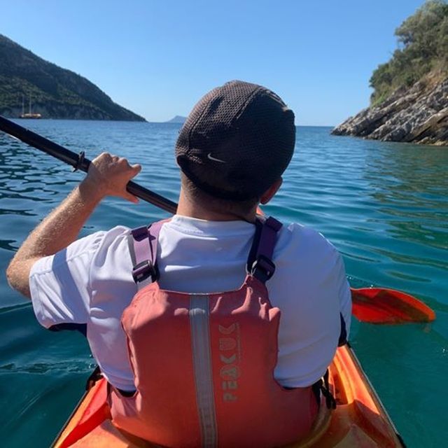 Lefkada: Hidden Blue Cave Kayak Trip with Lunch & Fruits - Snorkeling above large red starfish