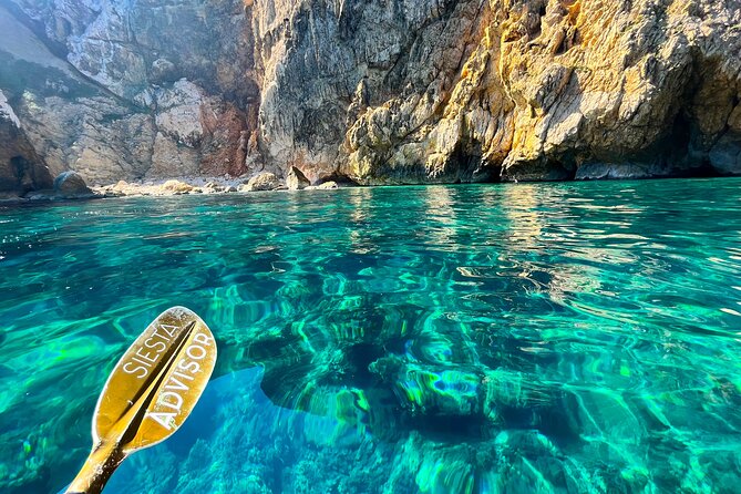 Paddle Board Paradise: Magical Snorkel & Cave Exploring SUP Tour - Entering the sea caves by paddleboard