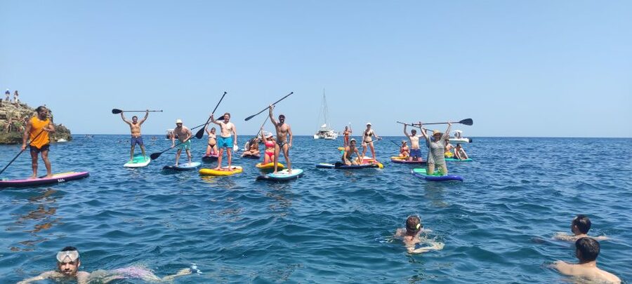 Polignano a Mare: Stand-Up Paddle Board Sea Cave Trip - Entering the caves around Grotta Palazzese