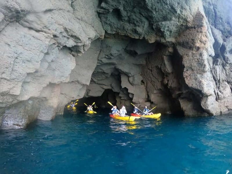Puerto Mogán: Guided Adventure Kayak Tour in Caves & Snorkel - The first 80 meters: carrying kayaks to the sea