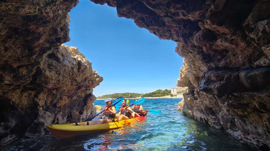 Pula: Cave Kayak Tour, Snorkeling and Island Jumping - Three islands, one good swimming stop