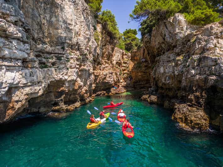 Pula: Kayak Adventure with Cave & Island Snorkeling - What the guides add to the experience