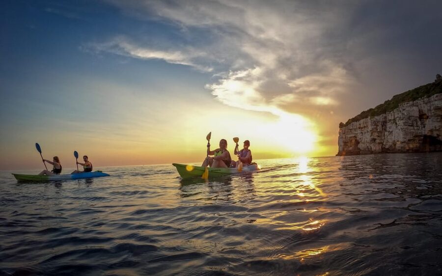 Pula: Kayaking,Snorkeling, Cliff jumping Tour with Wetsuit - First water stop: 30 minutes of swimming and snorkeling