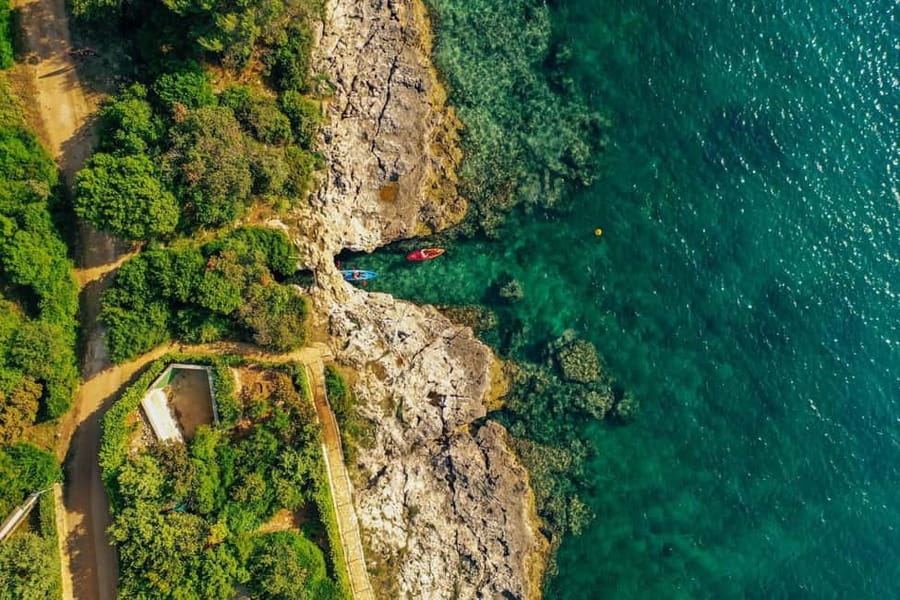 Pula: Three Island Kayak Tour with Cave Photo & Snorkeling - Returning by kayak
