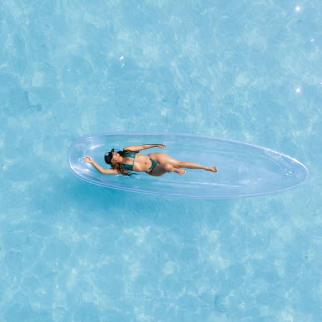 Punta Cana: Single Clear Kayak Photoshoot - Getting into the clear kayak at Los Corales Beach