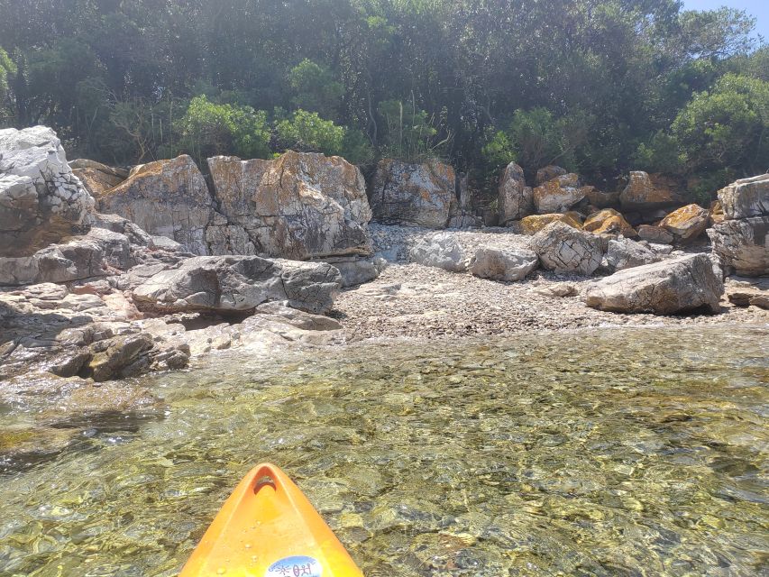 Rovinj: Golden Cape Desert Islands Kayak & Snorkeling Tour - Getting comfortable in a tandem kayak