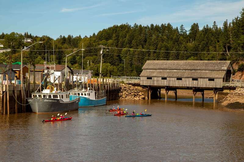 Saint John: Guided Kayaking Tour of St. Martins Sea Caves - Paddling out through St. Martins Harbor