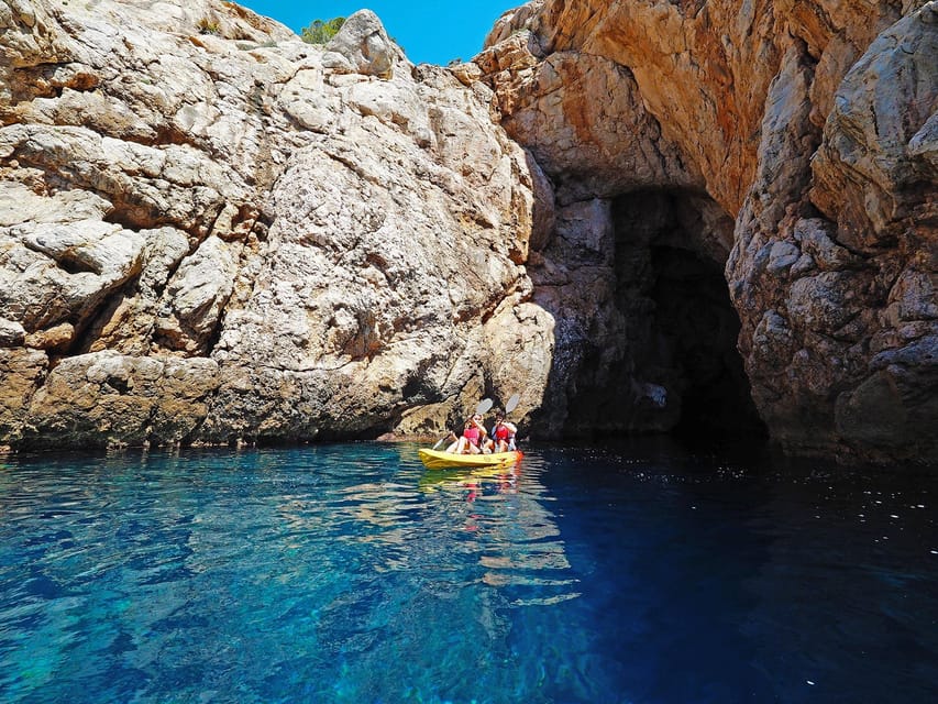 Sant Elm: Guided kayak tour to Cala en Tío with caves - Starting in Sant Elm with a short safety lesson