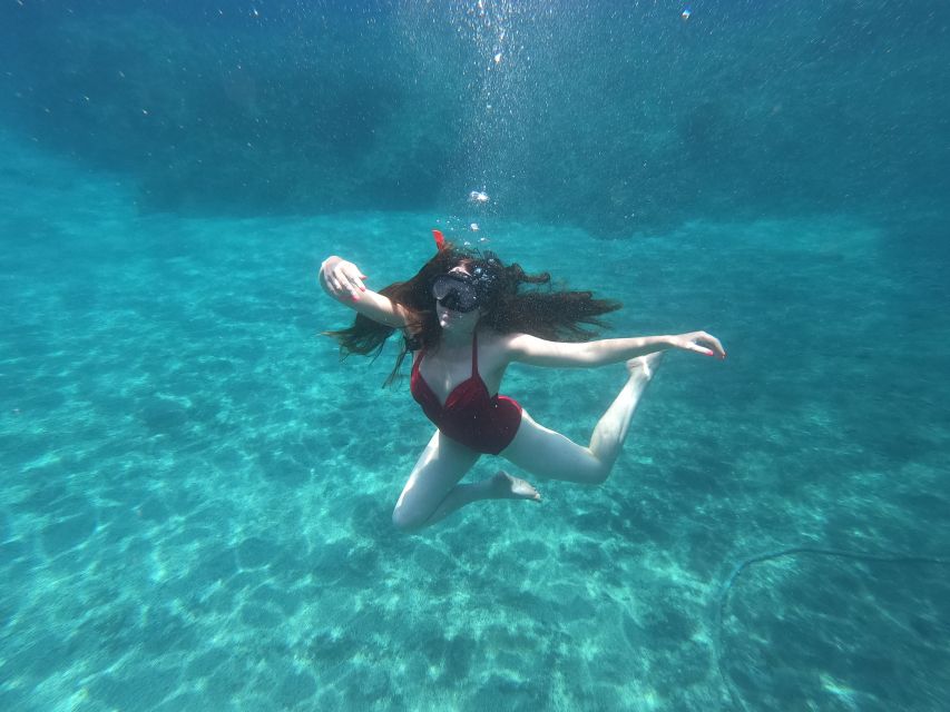 Santorini: Sea Caves Kayak Trip with Snorkeling and Picnic - Black Mountain, snorkeling, and time in the water