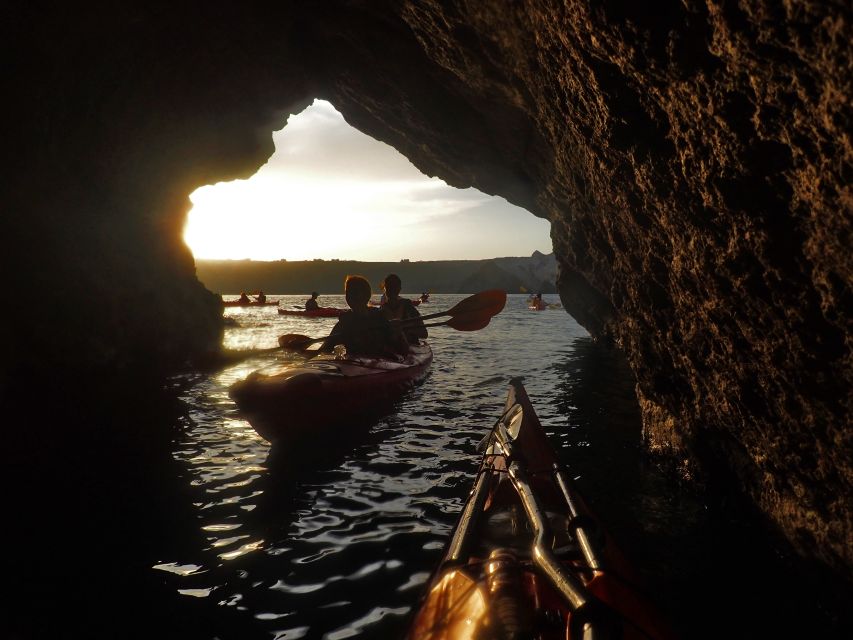 Santorini: Sunset Sea Kayak with Light Dinner - Sea caves and Black Mountain at sunset