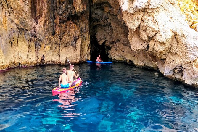 Sea Caves & Coves Snorkeling Paddle Boarding Tour - Cala Bassa and the sea cave