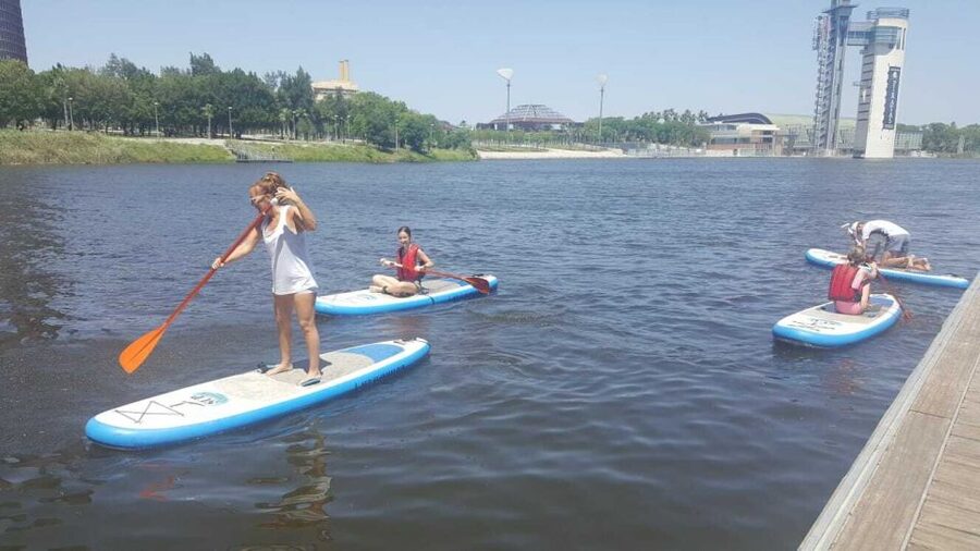 Seville: Stand Up Paddle Board Rental - Beneath the Isabel II and San Telmo bridges