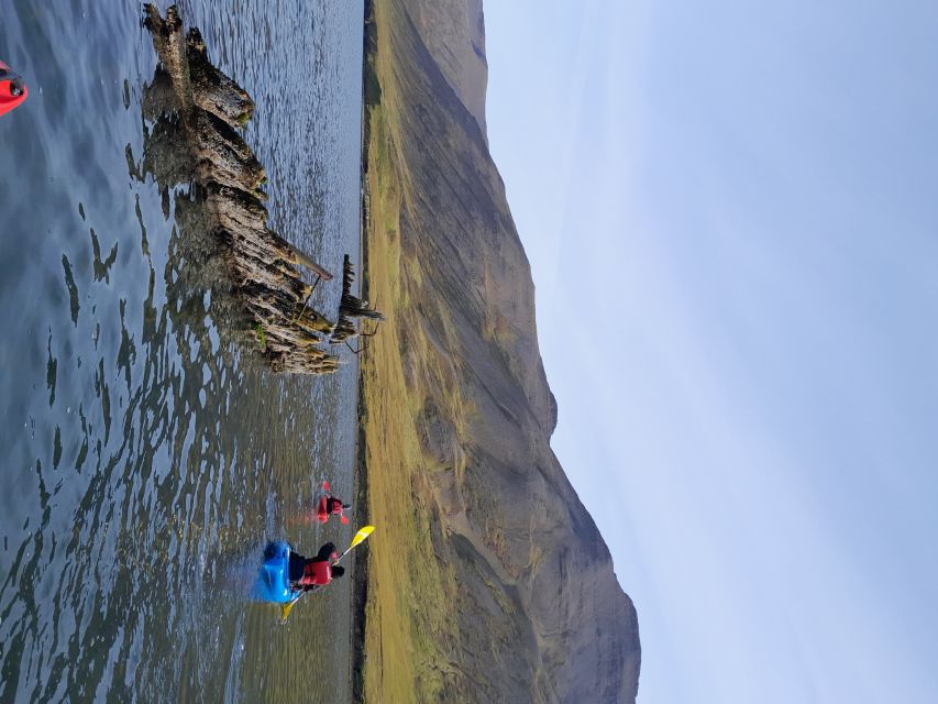 Siglufjörður / Siglufjordur: Guided kayak tour. - The 1919 avalanche site and the cost of living beside mountains