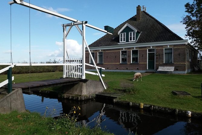 Small-Group Guided Sunset Canoe Tour in Waterland with Dinner - Dutch water management in real time