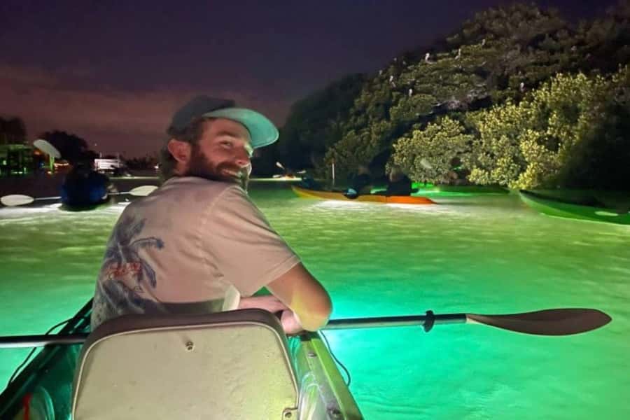 St. Pete Beach: Glass Bottom Kayak Fish Feeding Night Tour - Feeding fish under the boat