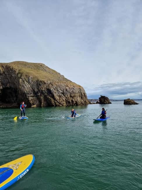 Stackpole Quay: Paddle Boarding Tour - Learning to paddle before the coast opens up