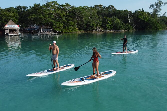 Sunrise on Paddleboard with breakfast in the lagoon of 7 colors - The Black Cenote shows another side of the lagoon