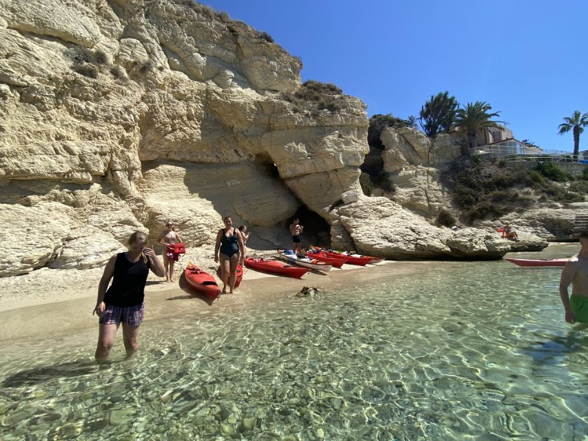 Sunset kayak tour Sella del diavolo - Paddling toward Poetto and the three bays